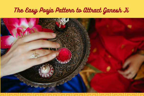 Hand placing red powder on a pooja thali with a pink flower. 
