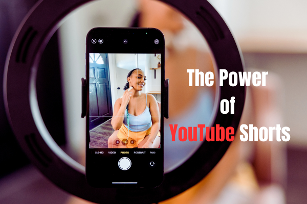 The power of YouTube Shorts – woman recording video with smartphone and ring light for growth and earning money online.
