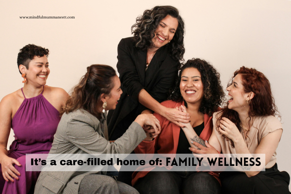 A group of women smiling and supporting each other, symbolizing care, connection, and family wellness at Mindful Mumma Nest.

