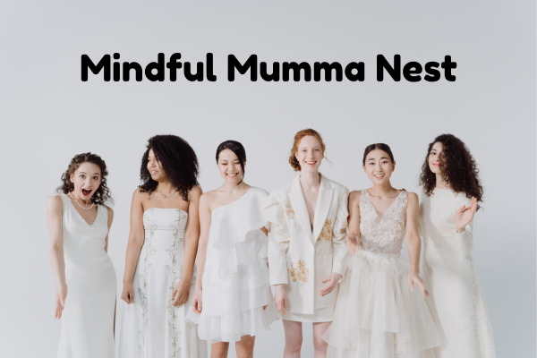 A diverse group of women standing together in white outfits, representing unity, empowerment, and the spirit of Mindful Mumma Nest.
