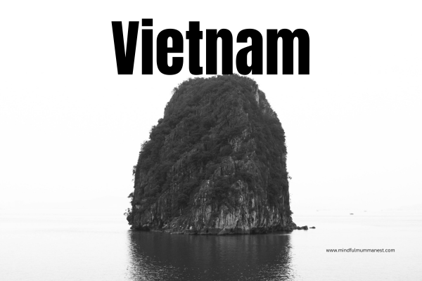 Limestone island in Halong Bay Vietnam surrounded by calm water